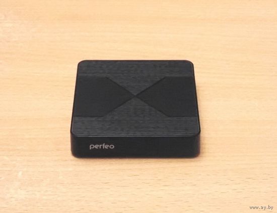 Смарт-приставка Perfeo Matrix (чёрный цвет). Характеристики: Android, 4K, USB 2.0, Wi-Fi 802.11n. Комплект: дистанционный пульт, кабели, коробка.
