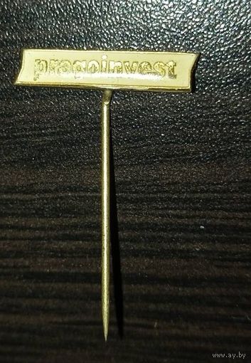 Pragoinvest. Белая эмаль, латунь, игла.