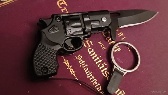 Нож брелок. Пистлет. Не точен, отличный брелок для ключей.