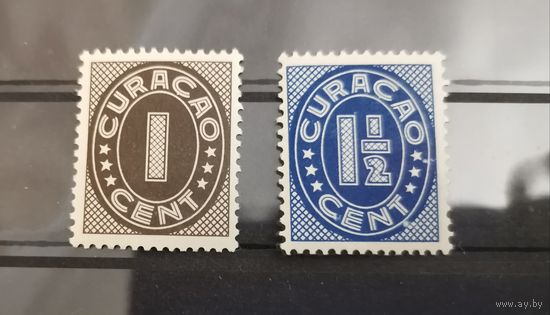 Кюрасао.Почтовые марки с цифрами 1936-1942 гг.