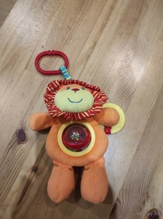 Подвесная игрушка Mothercare оранжевого цвета, яркая, на животе шарик. В идеальном состоянии.