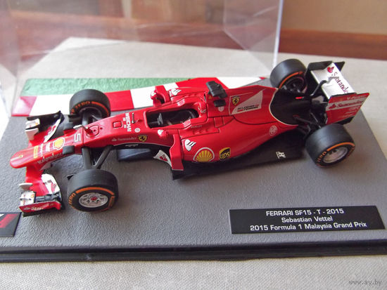 Модель автомобиля 1-43 Фомула 1 Formula 1 F1 Ferrari SF15-T 2015 Sebastian Vettel 2015 Malaysia Grand Prix В комплекте модель, бокс, журнал Состояние модель как новая журнал отличное